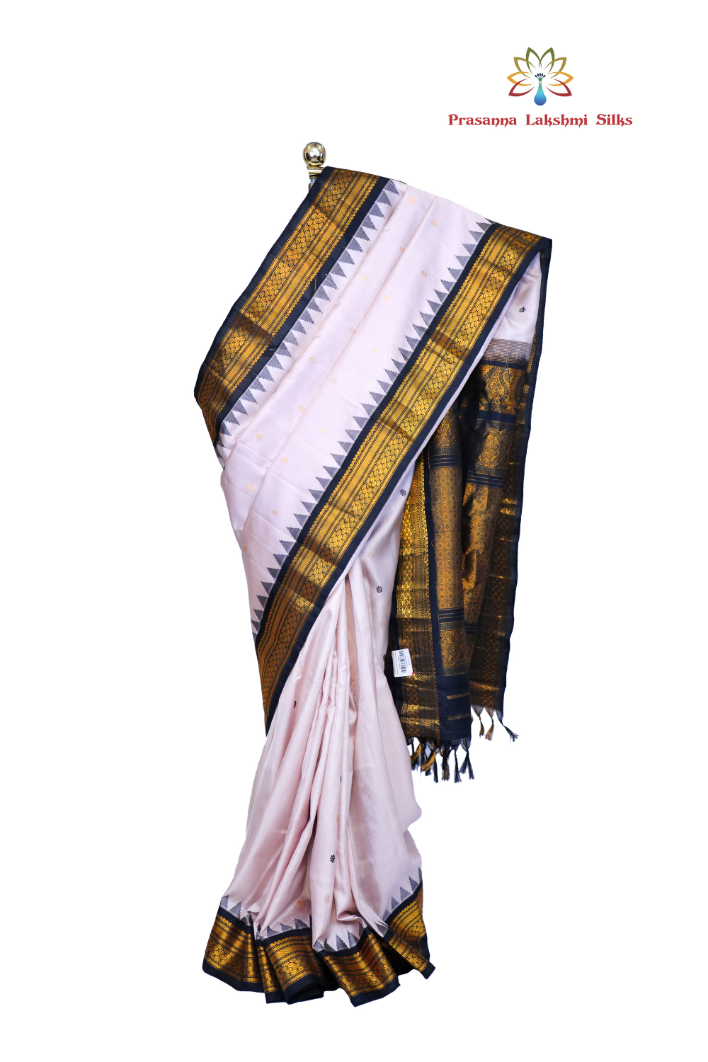 Handloom Gadwal pure silk saree with intricate small zari motifs and rich woven pallu.
