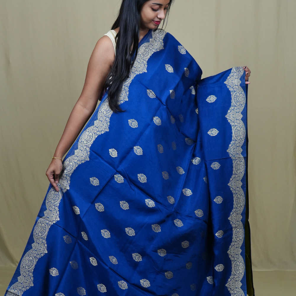 Elegant Banarasi Munga silk saree suitable for all occasions with intricate zari detailing.