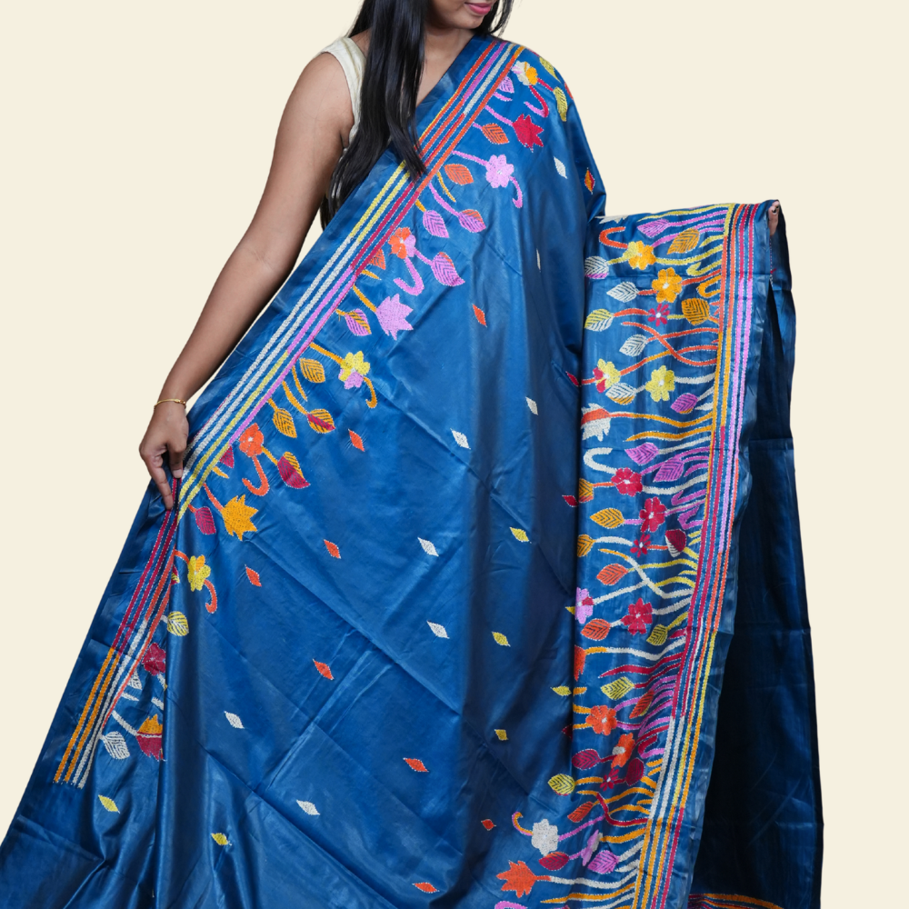 Elegant silk saree featuring Kantha work borders and detailed Kantha pallu design.
