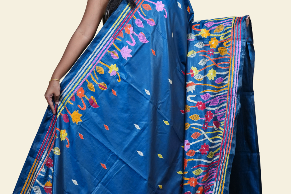 Elegant silk saree featuring Kantha work borders and detailed Kantha pallu design.
