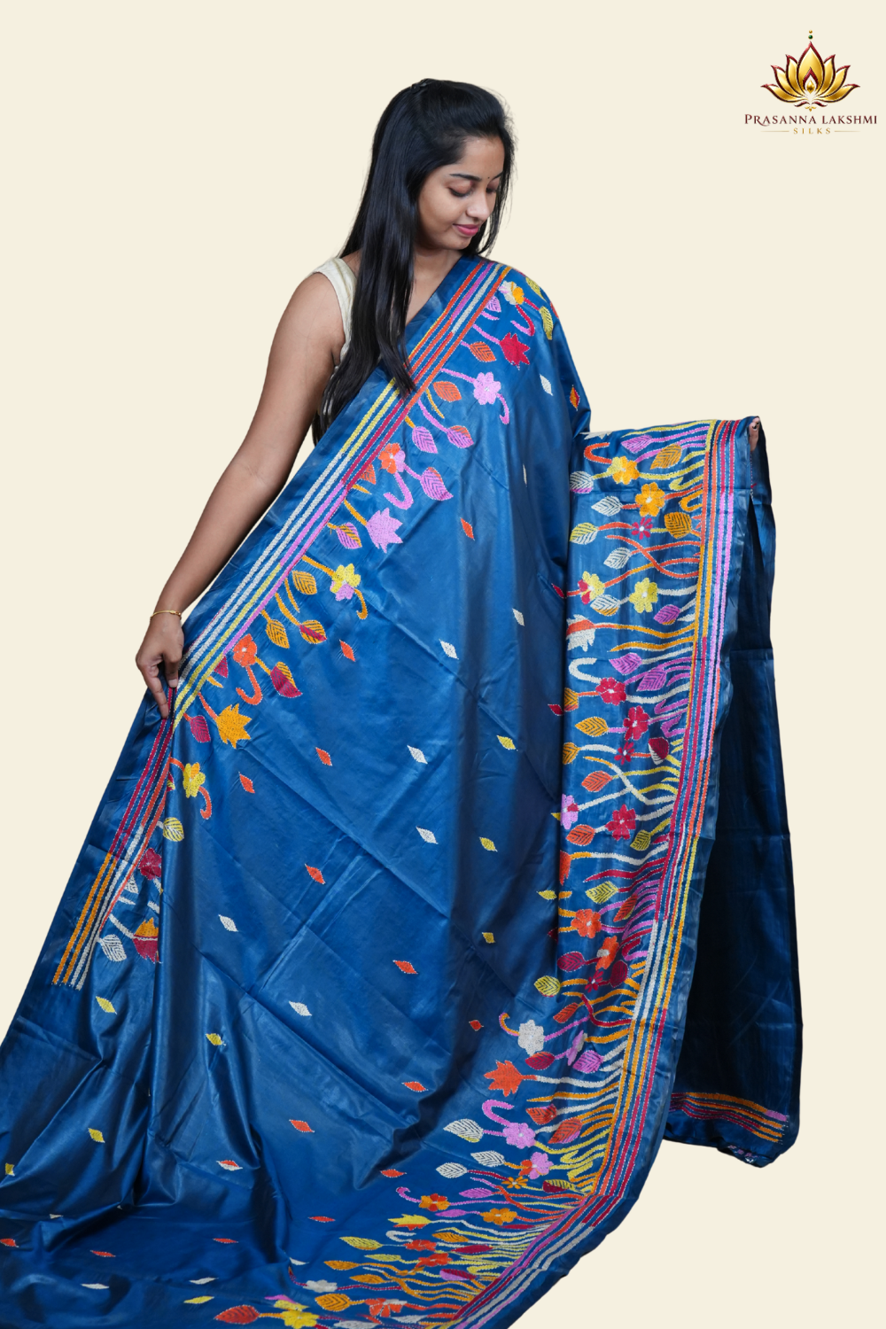 Elegant silk saree featuring Kantha work borders and detailed Kantha pallu design.
