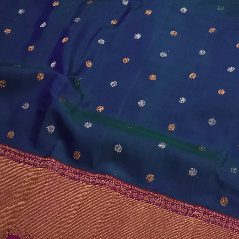 Premium Gadwal Silk Saree with woven zari motifs, luxurious brocade pallu, meenakari turning border, and matching contrast blouse.
