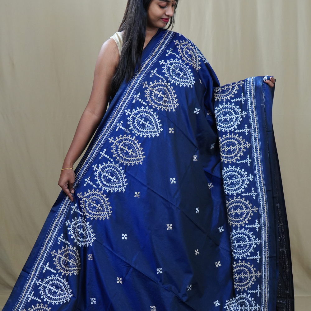Traditional semi silk saree featuring beautiful hand Kutch work borders and artistic design.

