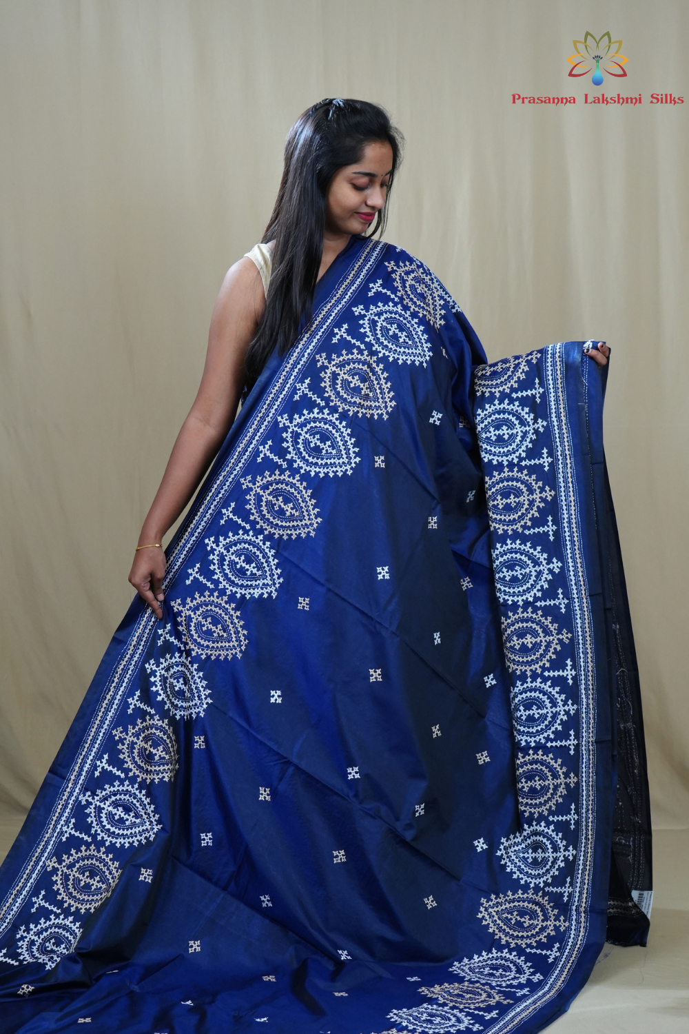 Traditional semi silk saree featuring beautiful hand Kutch work borders and artistic design.
