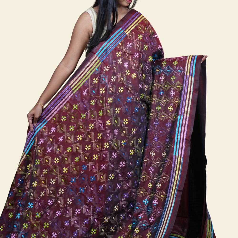 Elegant silk saree featuring Kantha work borders and detailed Kantha pallu design.
