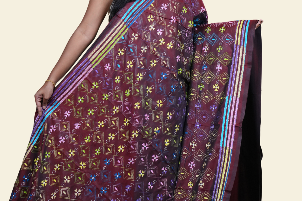 Elegant silk saree featuring Kantha work borders and detailed Kantha pallu design.
