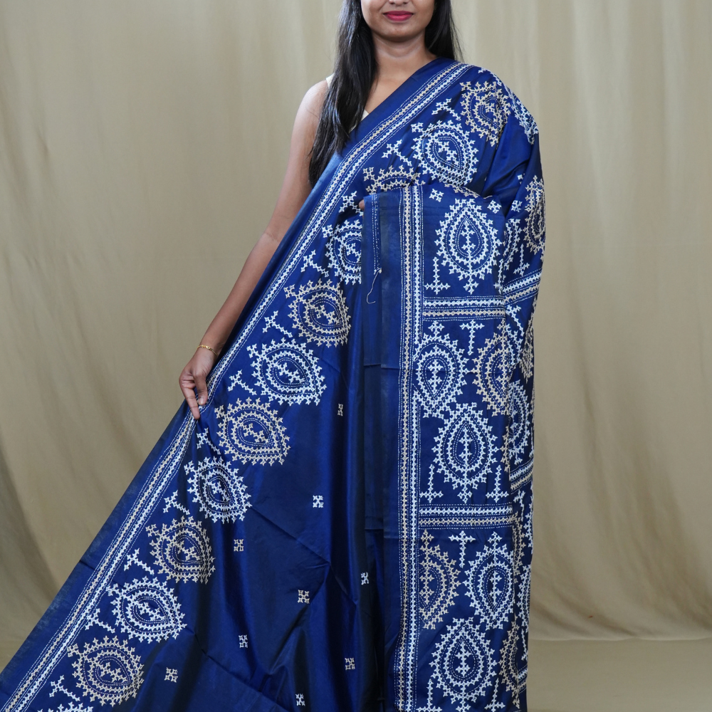 Semi Bangalore Silk Saree with all-over Kutch work motifs and rich embroidered pallu.
