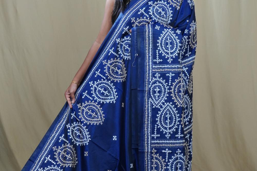 Semi Bangalore Silk Saree with all-over Kutch work motifs and rich embroidered pallu.
