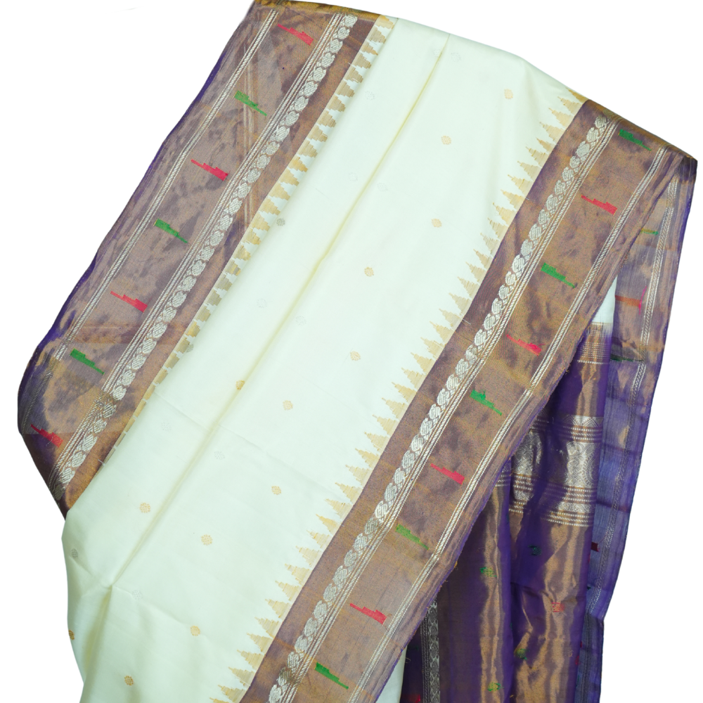 Traditional handloom Gadwal pure silk saree with zari woven tissue borders suitable for weddings.