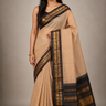 Pure handloom Gadwal cotton saree with traditional zari woven borders and simple zari stripes pallu.
