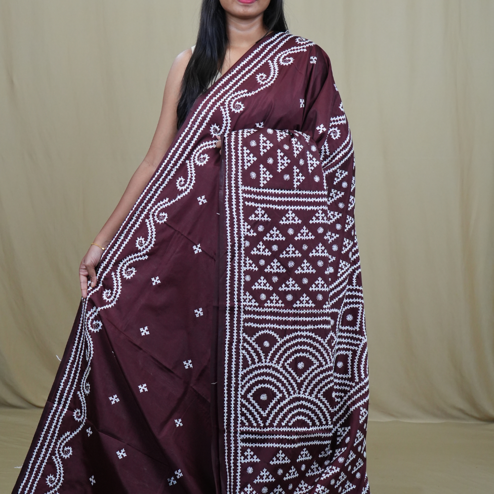 Semi Bangalore Silk Saree with all-over Kutch work motifs and rich embroidered pallu.
