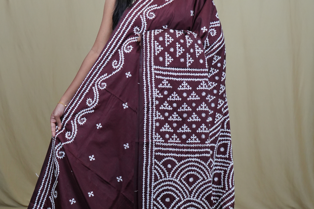 Semi Bangalore Silk Saree with all-over Kutch work motifs and rich embroidered pallu.
