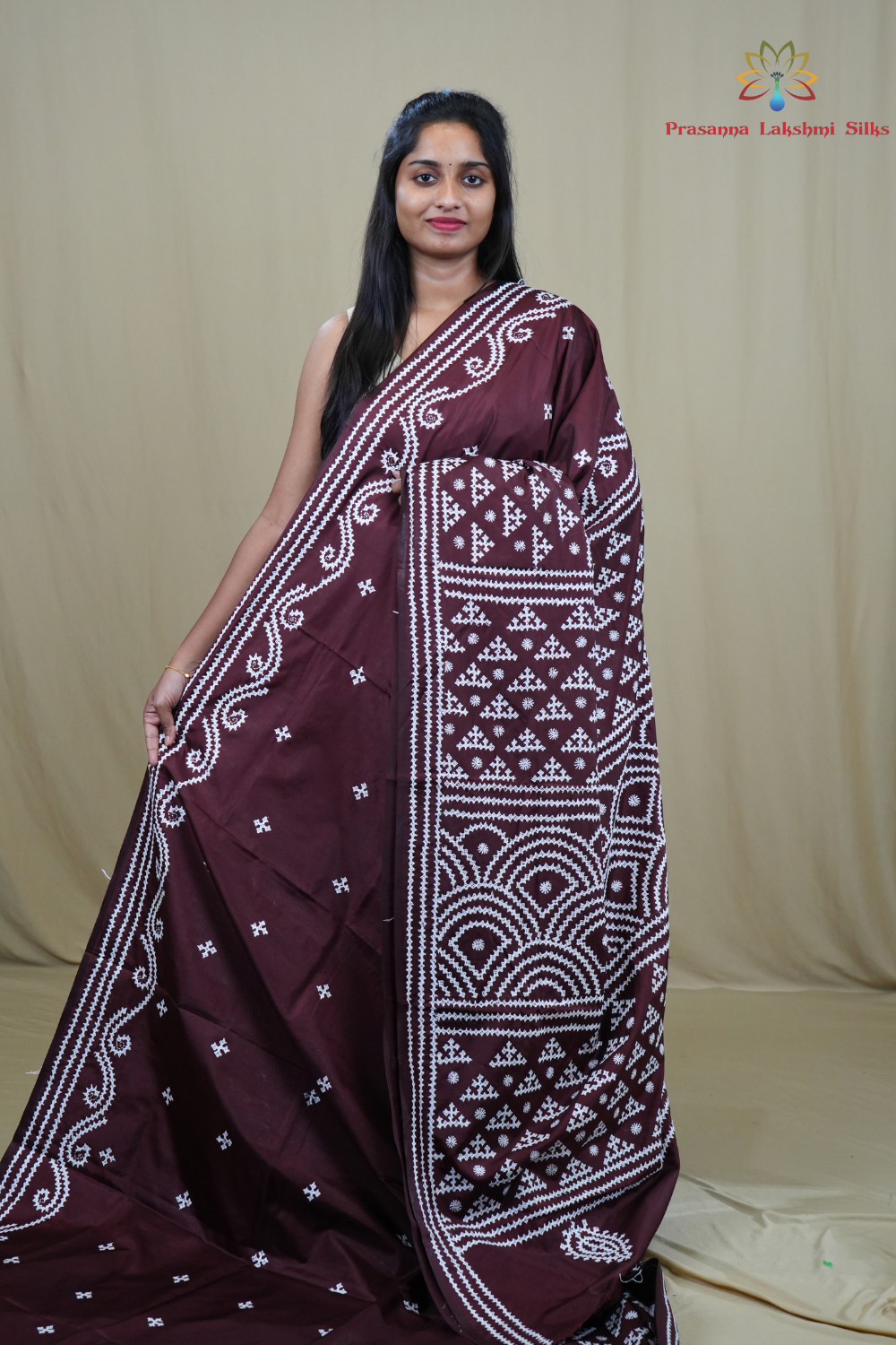 Semi Bangalore Silk Saree with all-over Kutch work motifs and rich embroidered pallu.
