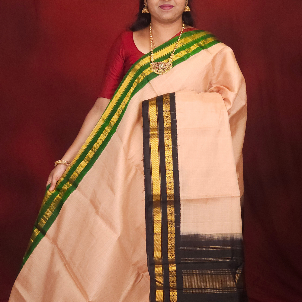 Lightweight Gadwal cotton saree featuring elegant zari border and striped pallu design.
