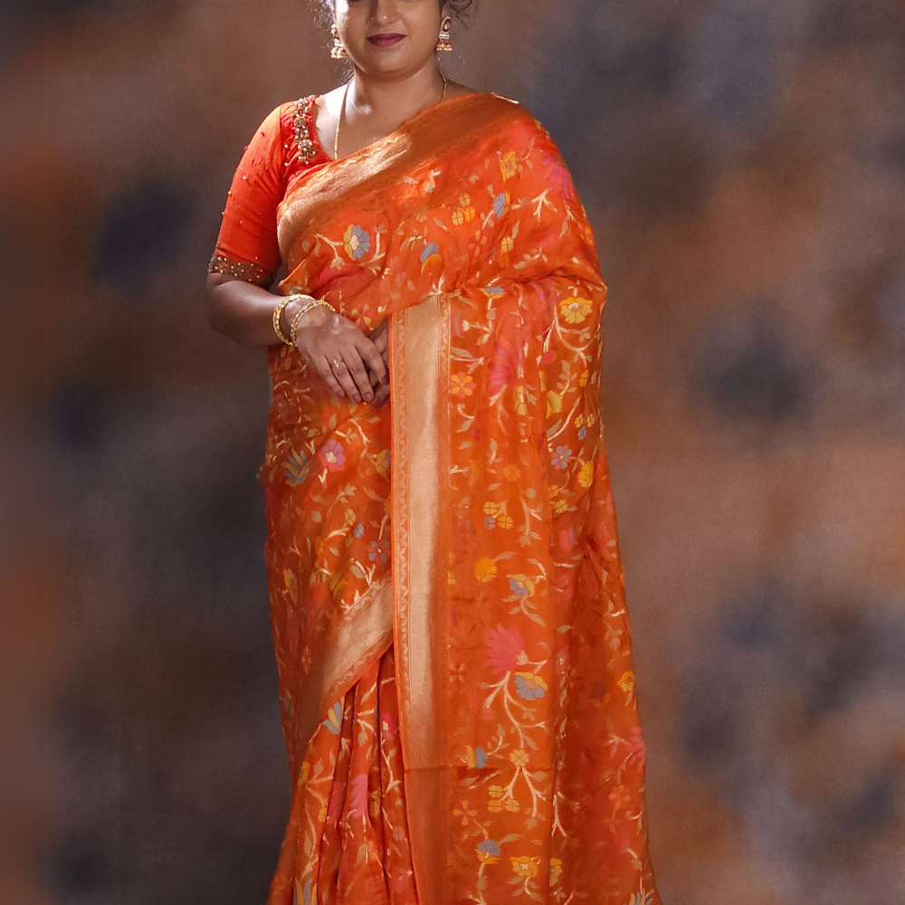 “Elegant floral organza saree with zari border”