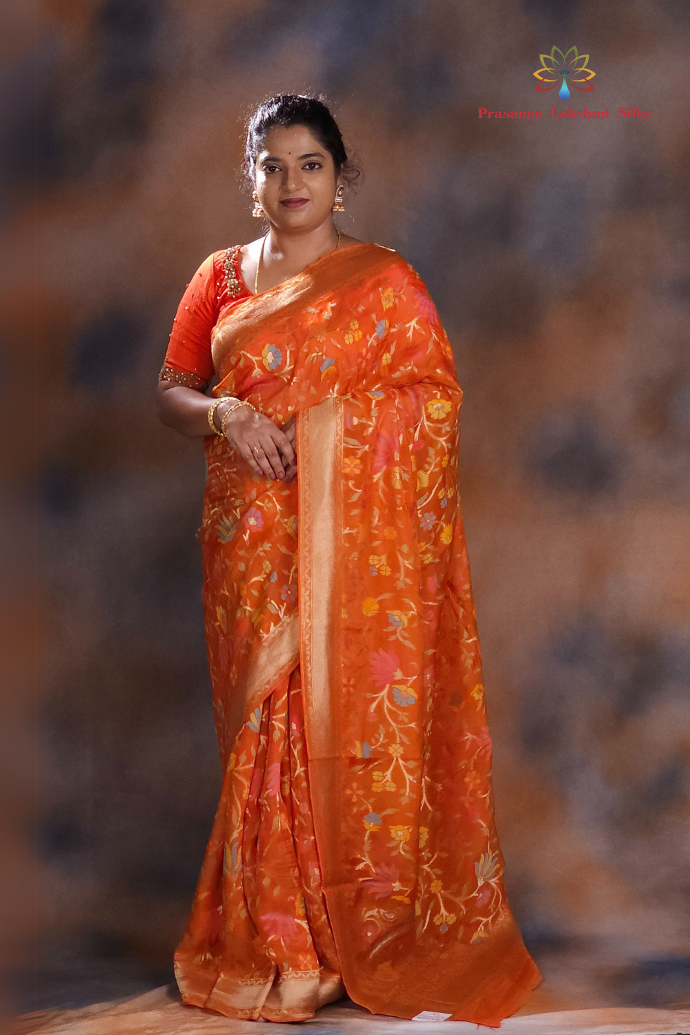 “Elegant floral organza saree with zari border”