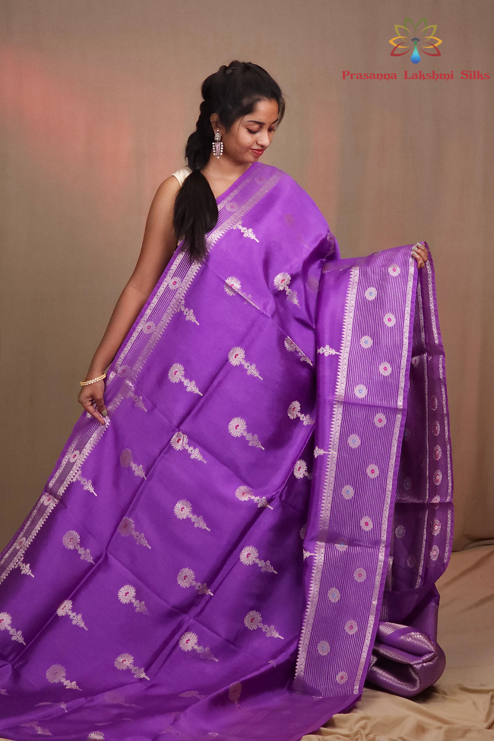 Traditional Chiniya silk saree featuring zari woven borders and stripe design
