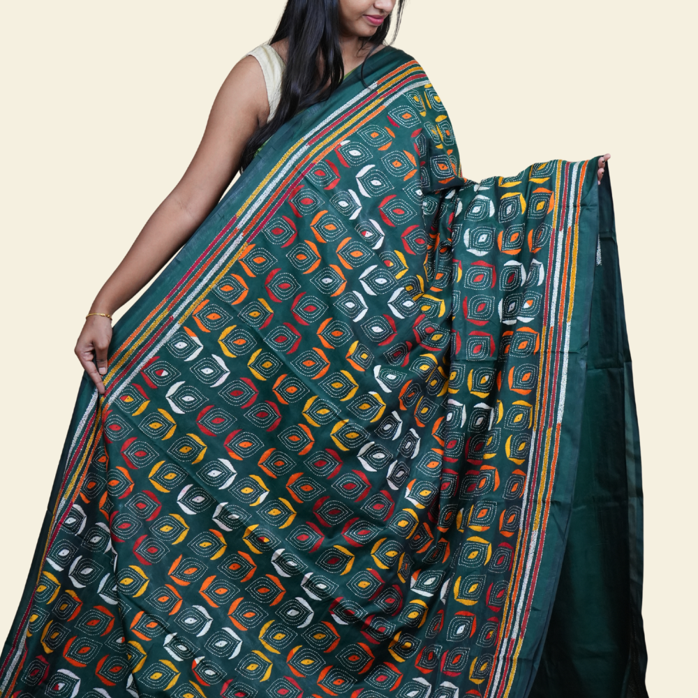 Elegant silk saree featuring Kantha work borders and detailed Kantha pallu design.