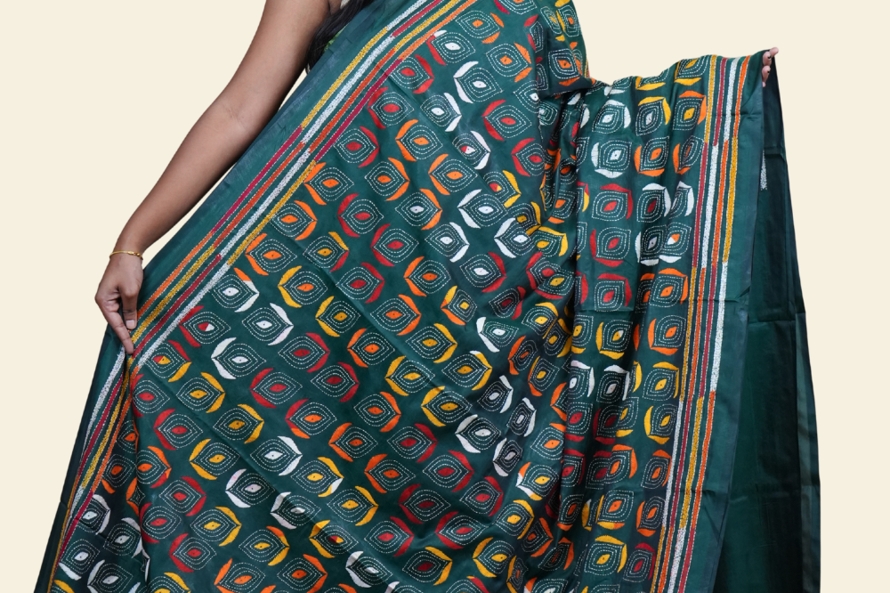 Elegant silk saree featuring Kantha work borders and detailed Kantha pallu design.