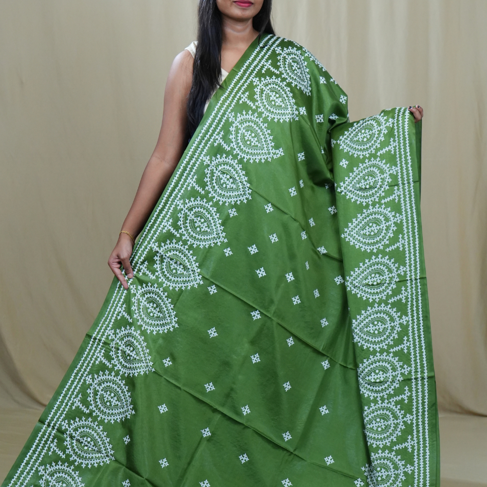 Traditional semi silk saree featuring beautiful hand Kutch work borders and artistic design.
