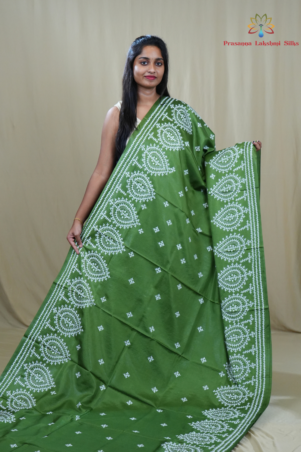 Traditional semi silk saree featuring beautiful hand Kutch work borders and artistic design.
