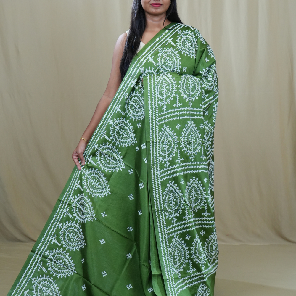 Semi Bangalore Silk Saree with all-over Kutch work motifs and rich embroidered pallu.
