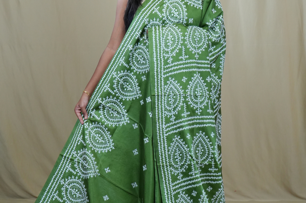 Semi Bangalore Silk Saree with all-over Kutch work motifs and rich embroidered pallu.
