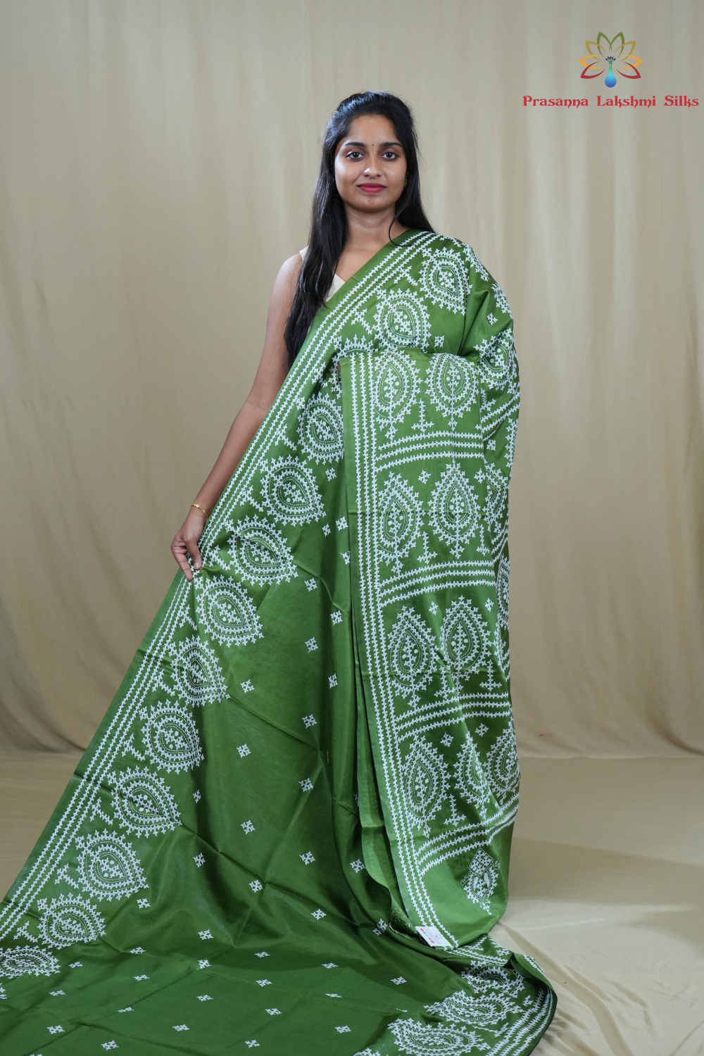 Semi Bangalore Silk Saree with all-over Kutch work motifs and rich embroidered pallu.

