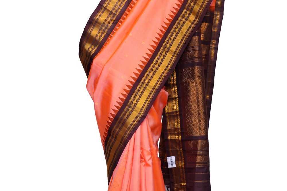 Handloom Gadwal pure silk saree with intricate small zari motifs and rich woven pallu.