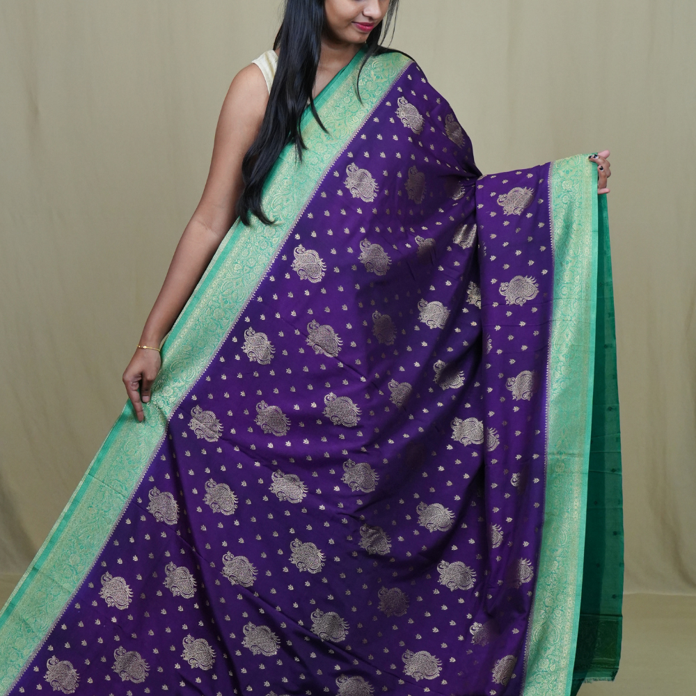 Elegant Mysore silk saree featuring contrast zari woven borders and matching blouse.
