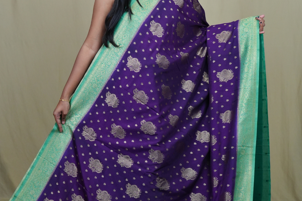 Elegant Mysore silk saree featuring contrast zari woven borders and matching blouse.
