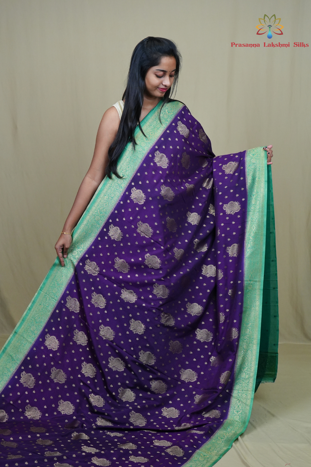 Elegant Mysore silk saree featuring contrast zari woven borders and matching blouse.
