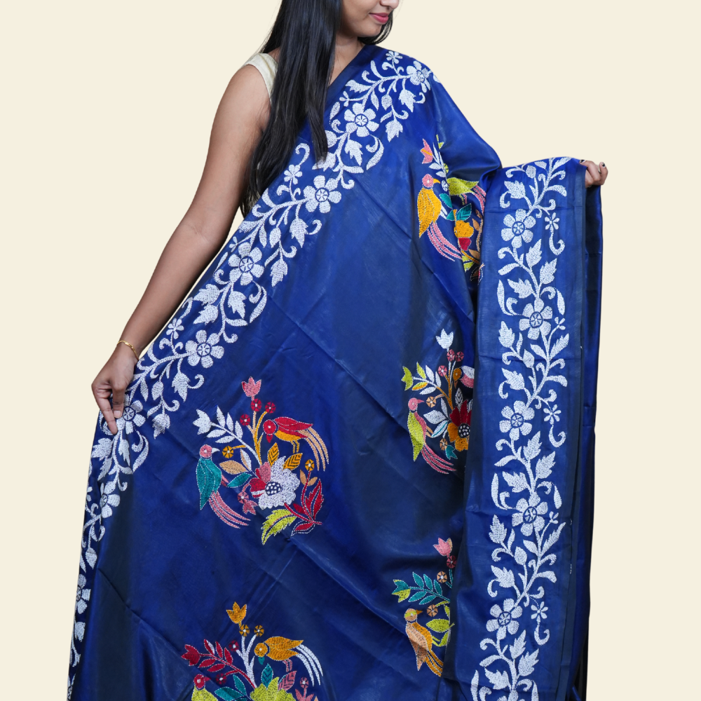 Elegant silk saree featuring Kantha work borders and detailed Kantha pallu design.
