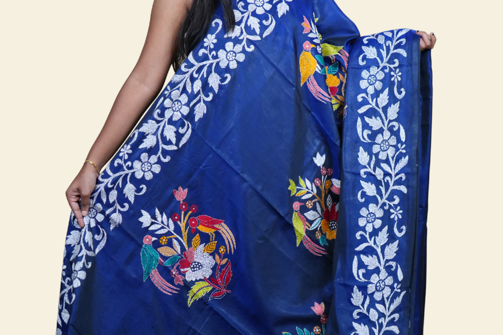 Elegant silk saree featuring Kantha work borders and detailed Kantha pallu design.
