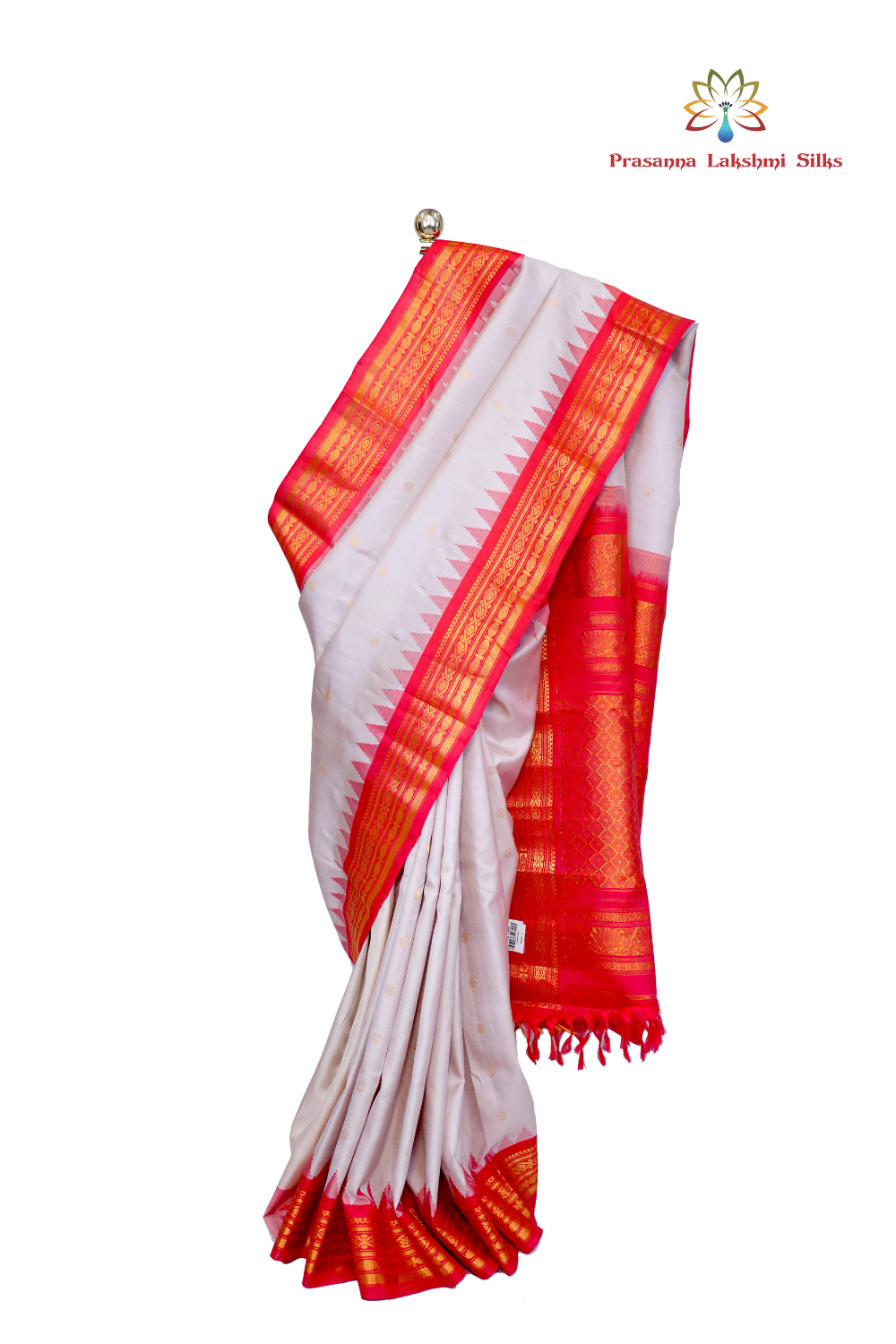 Handloom Gadwal pure silk saree with intricate small zari motifs and rich woven pallu.
