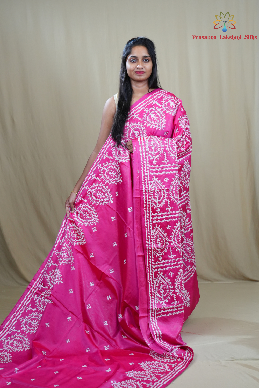 Semi Bangalore Silk Saree with all-over Kutch work motifs and rich embroidered pallu.
