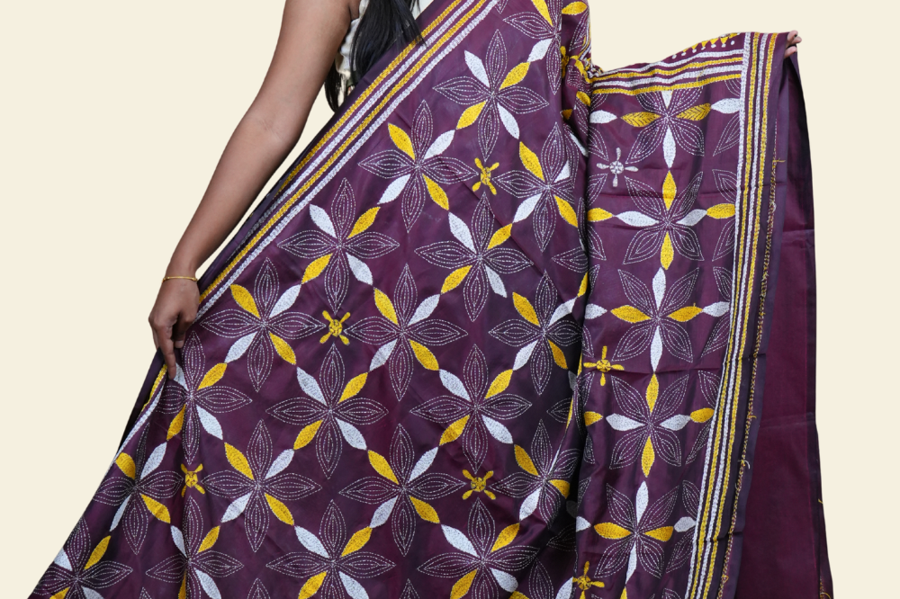 Elegant silk saree featuring Kantha work borders and detailed Kantha pallu design.
