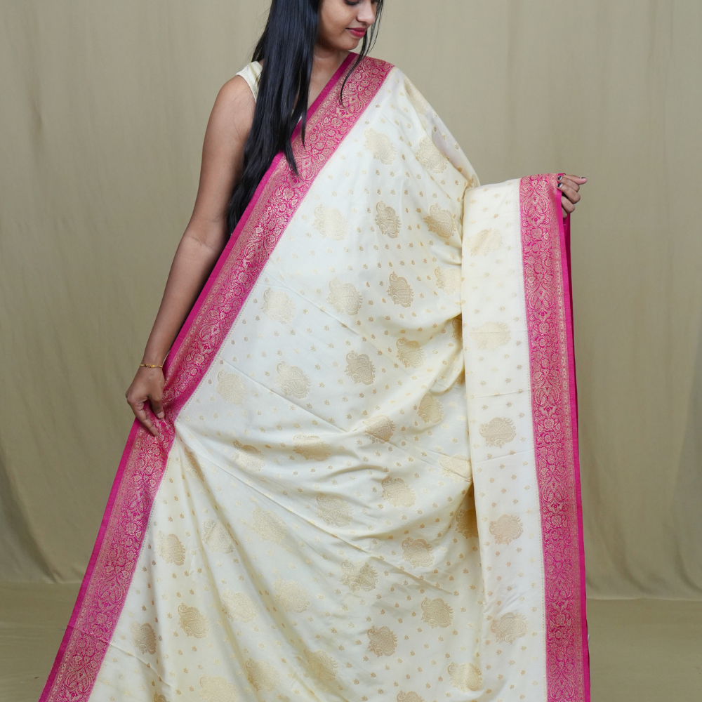 Elegant Mysore silk saree featuring contrast zari woven borders and matching blouse.

