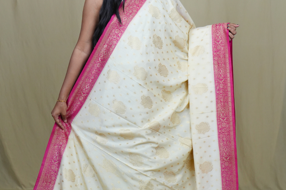 Elegant Mysore silk saree featuring contrast zari woven borders and matching blouse.
