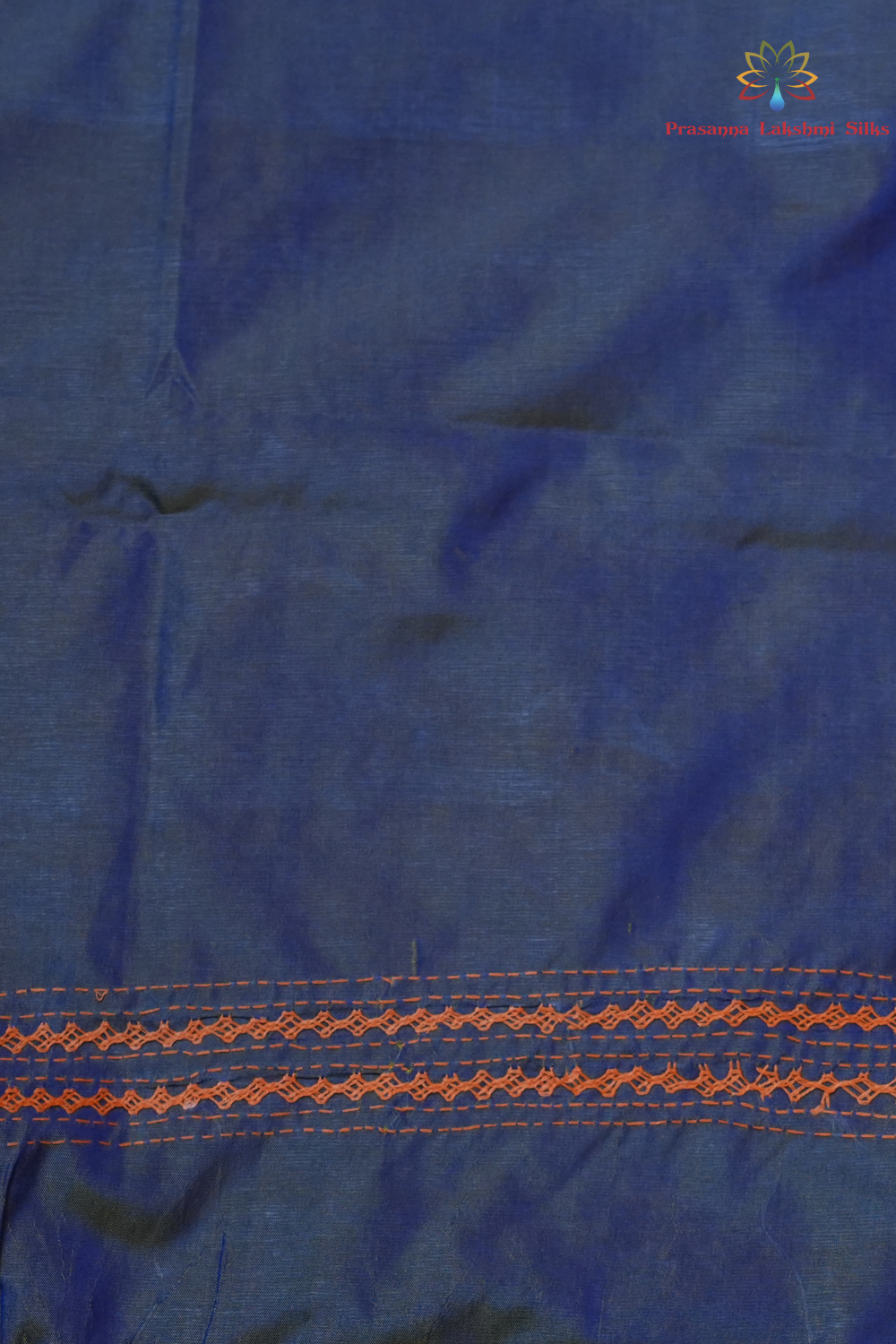 Semi Bangalore Silk Saree with all-over Kutch work motifs and rich embroidered pallu.
