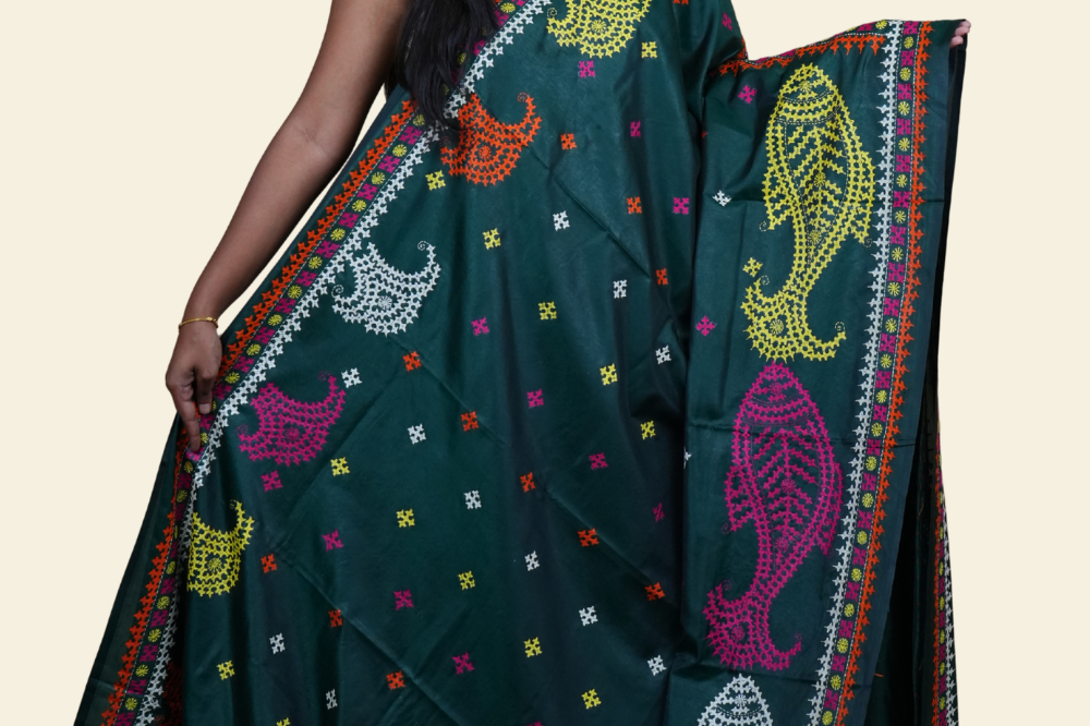 Elegant silk saree featuring Kantha work borders and detailed Kantha pallu design.

