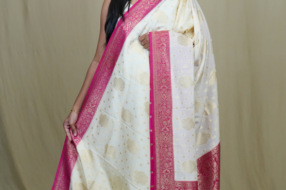 Semi Mysore silk saree with all-over zari woven motifs and rich brocade pallu.
