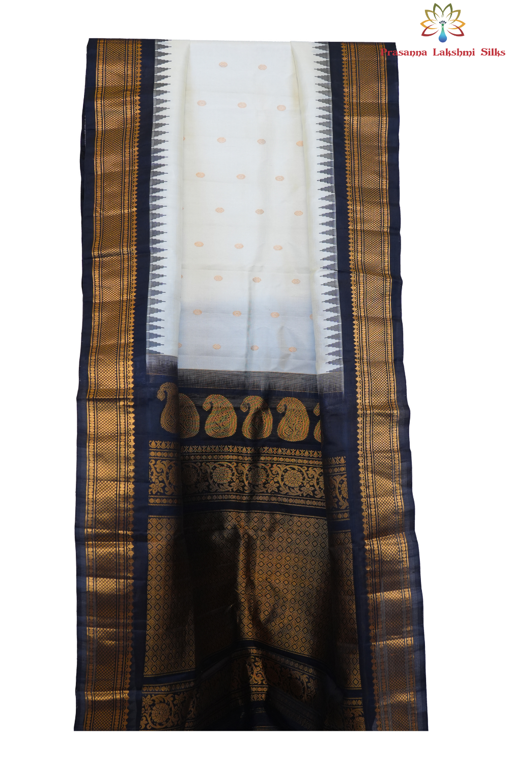 Traditional Gadwal silk saree featuring zari-woven borders and contrast blouse.
