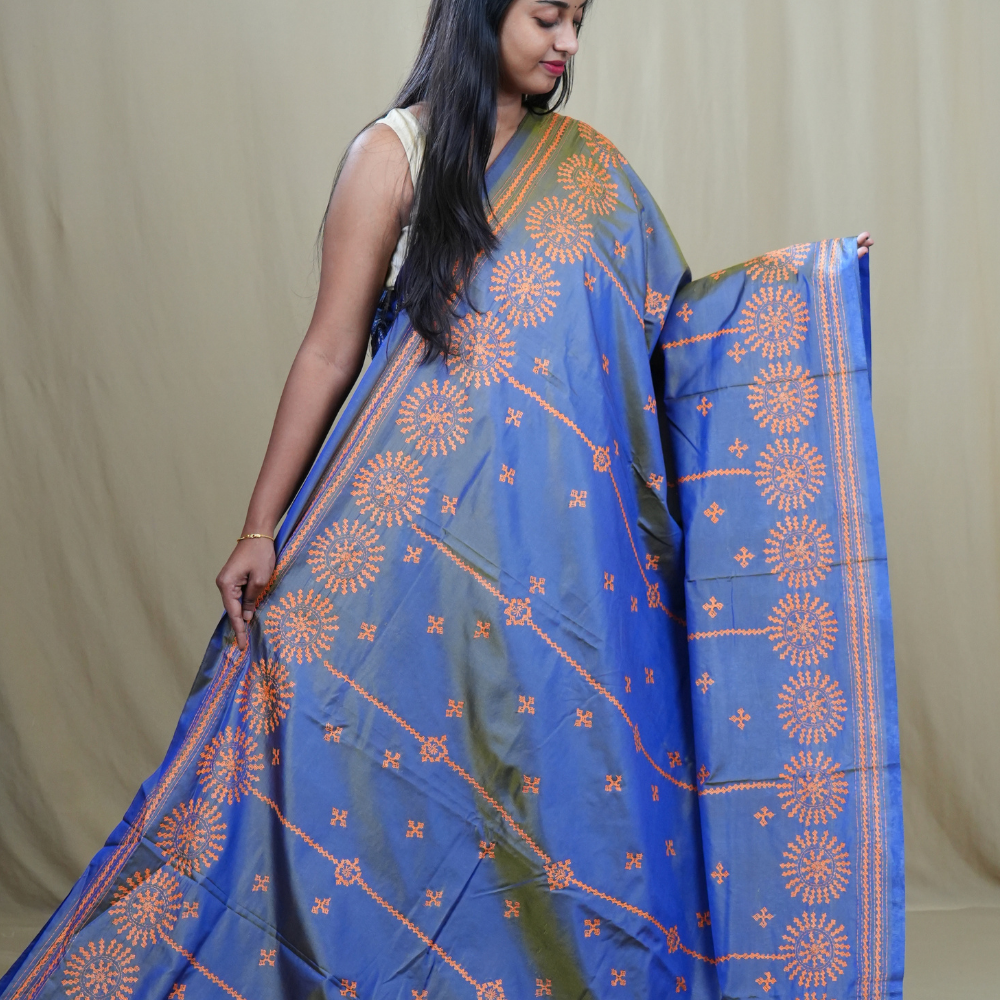 Traditional semi silk saree featuring beautiful hand Kutch work borders and artistic design.
