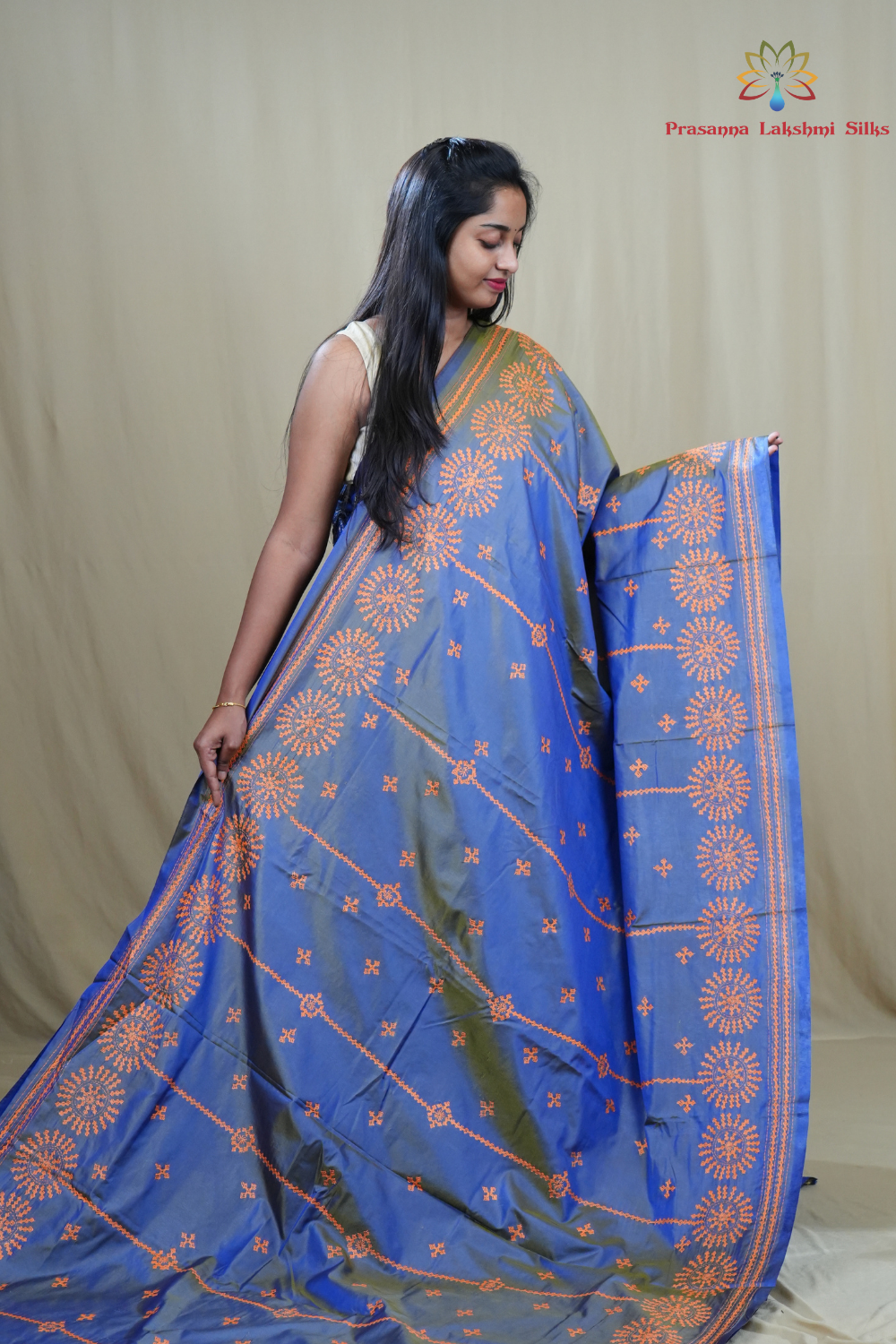 Traditional semi silk saree featuring beautiful hand Kutch work borders and artistic design.
