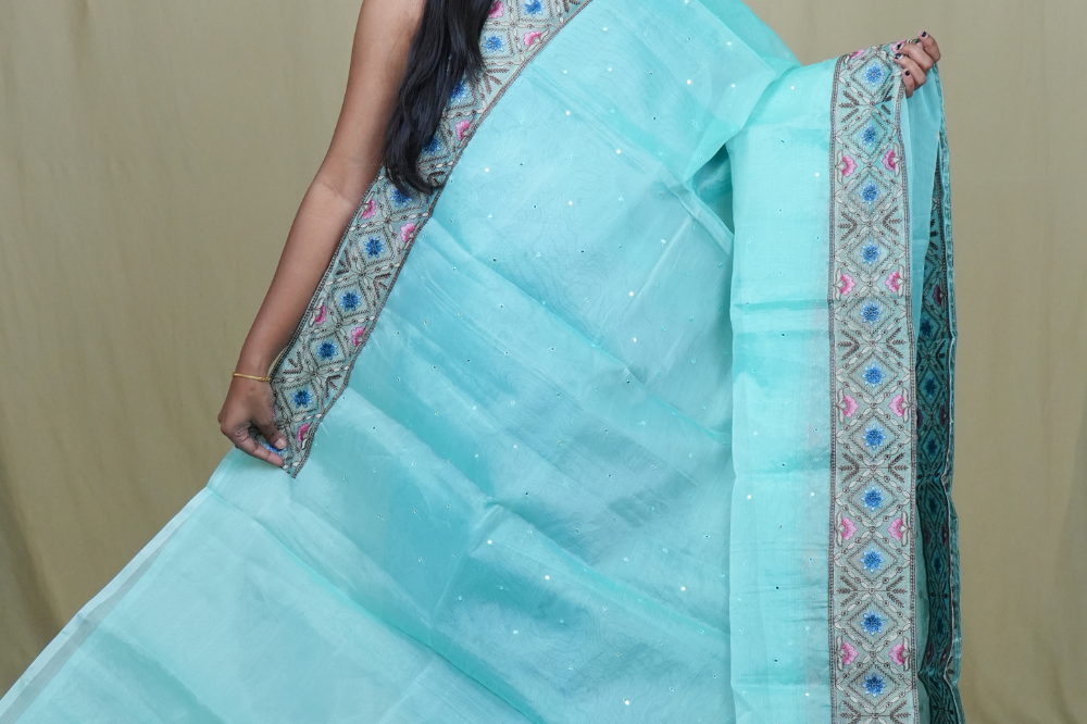 Traditional lightweight Organza Saree suitable for weddings and festive occasions with mirror work.