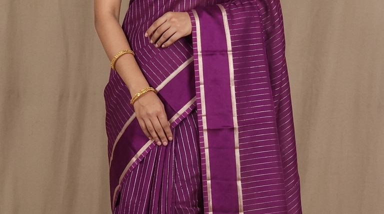 Organza saree with zari woven vertical stripes and plain satin borders
