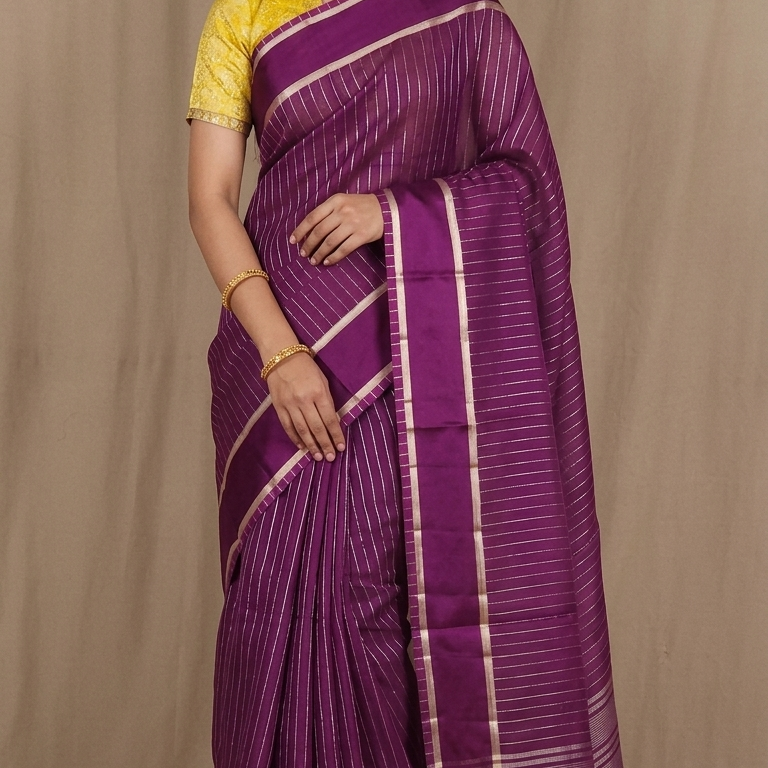 Organza saree with zari woven vertical stripes and plain satin borders
