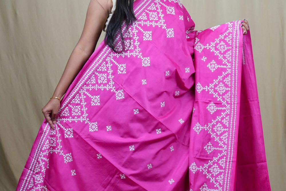 Traditional semi silk saree featuring beautiful hand Kutch work borders and artistic design.
