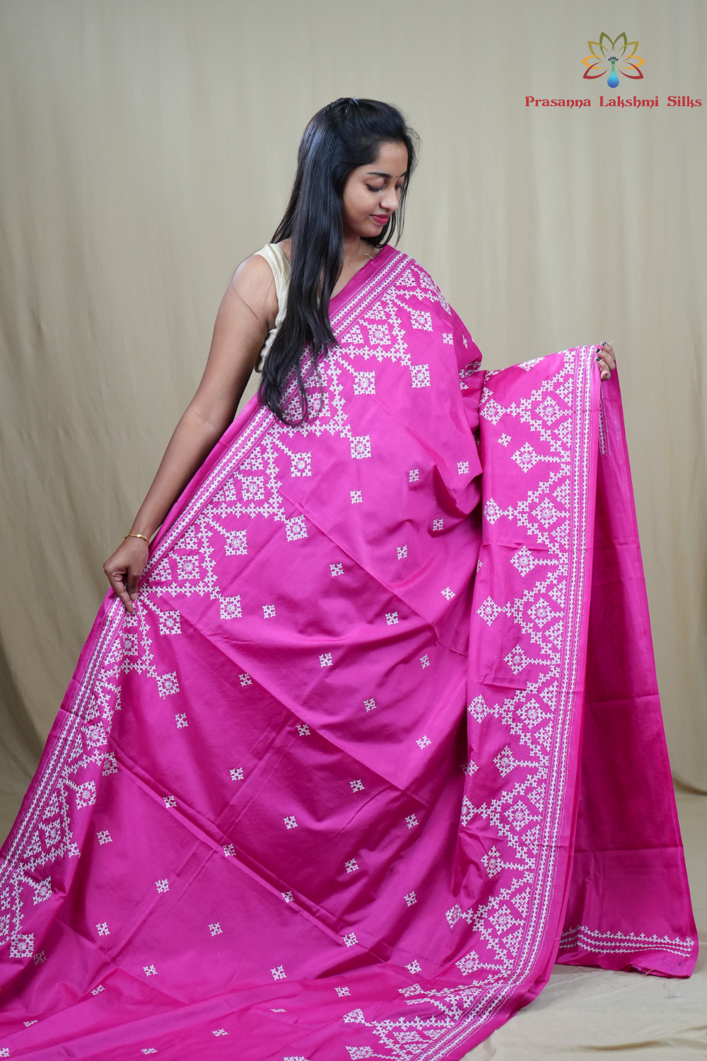 Traditional semi silk saree featuring beautiful hand Kutch work borders and artistic design.
